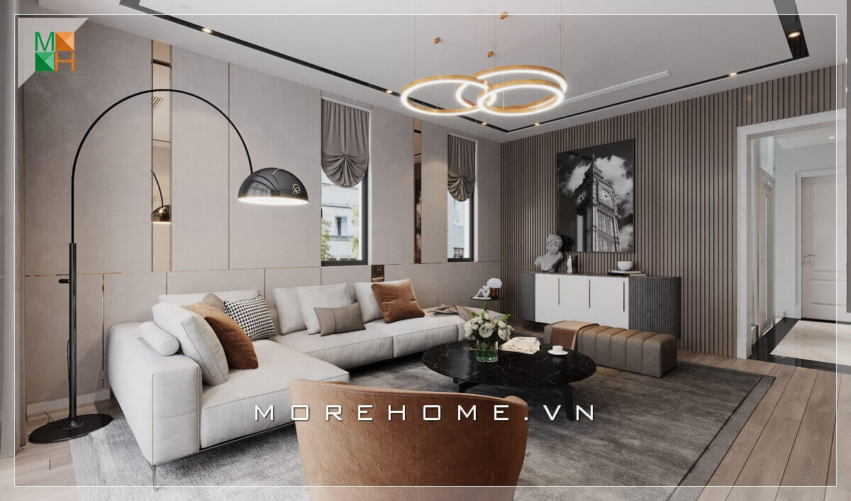 Mẫu thiết kế phòng khách phong cách hiện đại, với những chi tiết mạ vàng trang trí gắn tường kết hợp hệ thống đèn cây và đèn chùm mang đến sự cao cấp, sang trọng cho không gian